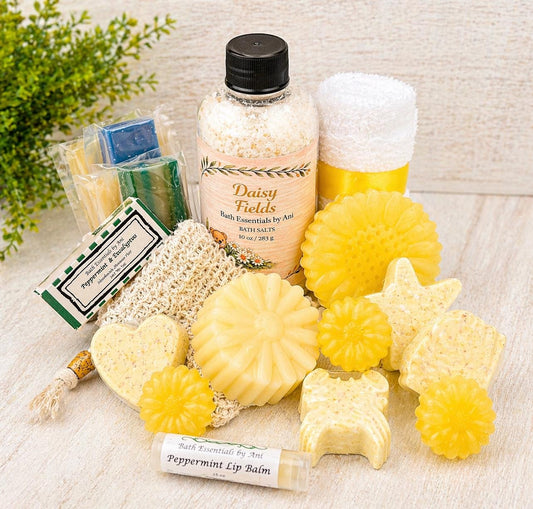 Bath gift basket with Daisy Fields bath essentials: yellow soaps, bath salt, and bottled essentials.