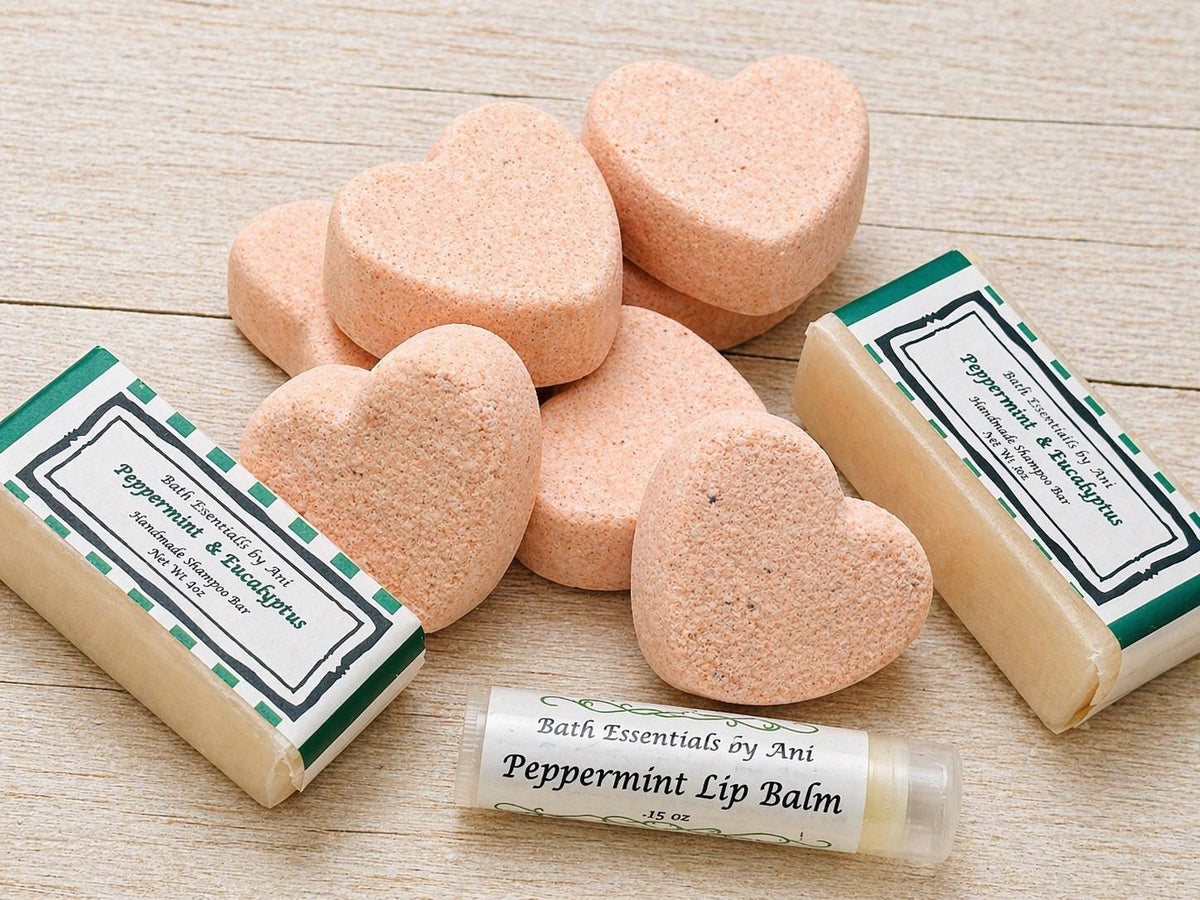 Bath bars and Peppermint lip balm tubes on a light wooden surface