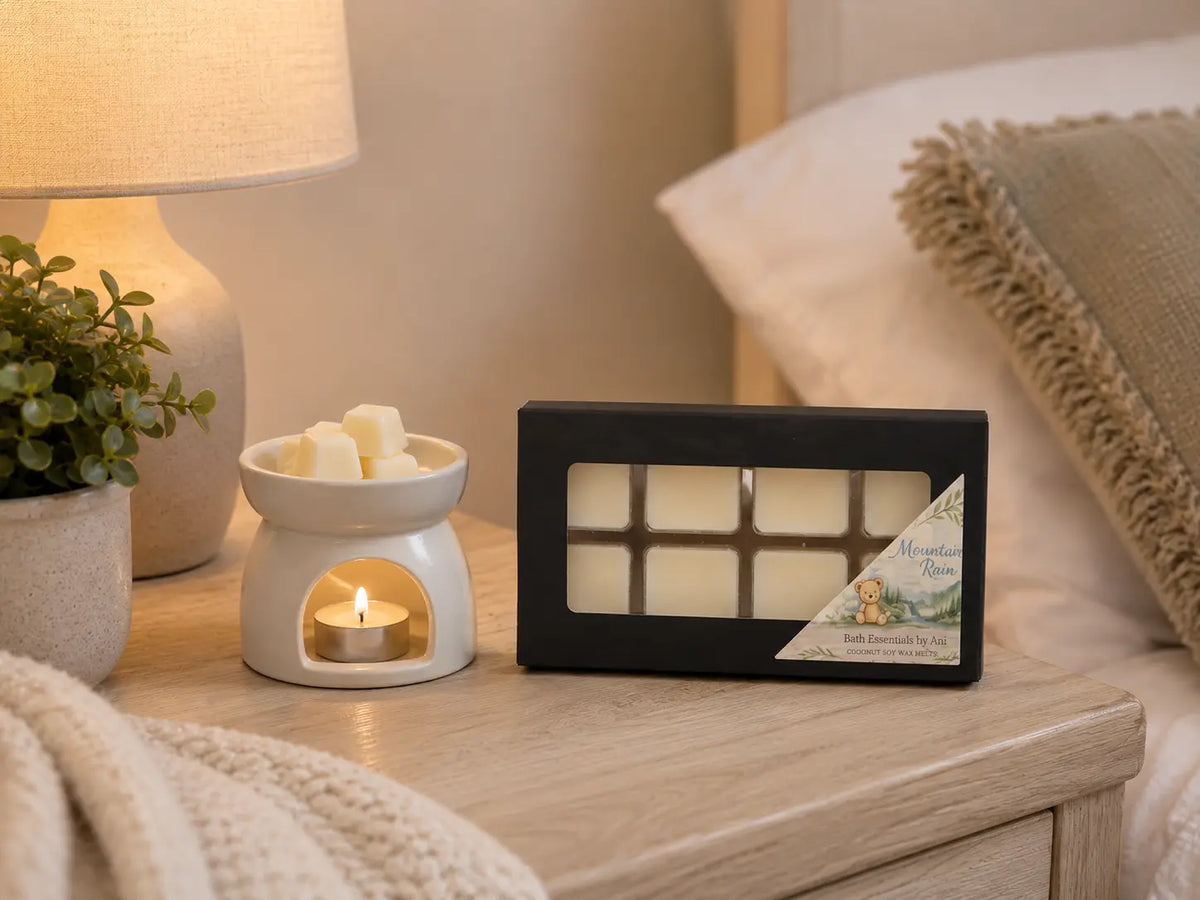 Spa gift set display with wax warmer candle, small soaps, and black melt box