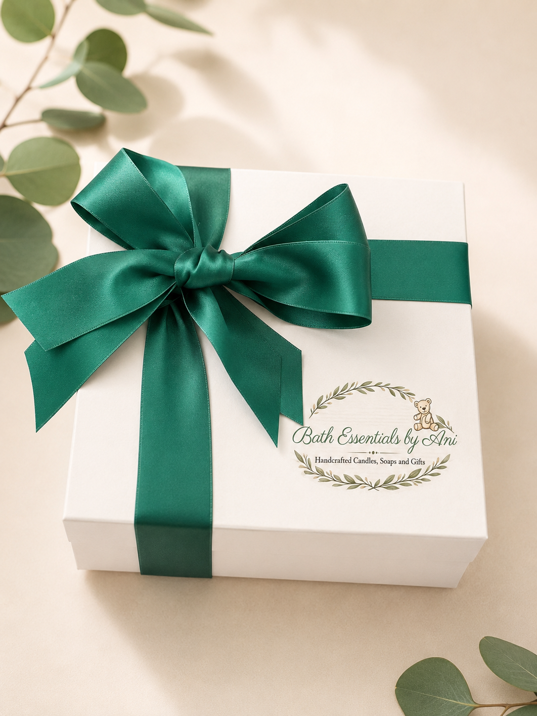 Bath gift box with teal ribbon and Bath Essentials by Ani logo