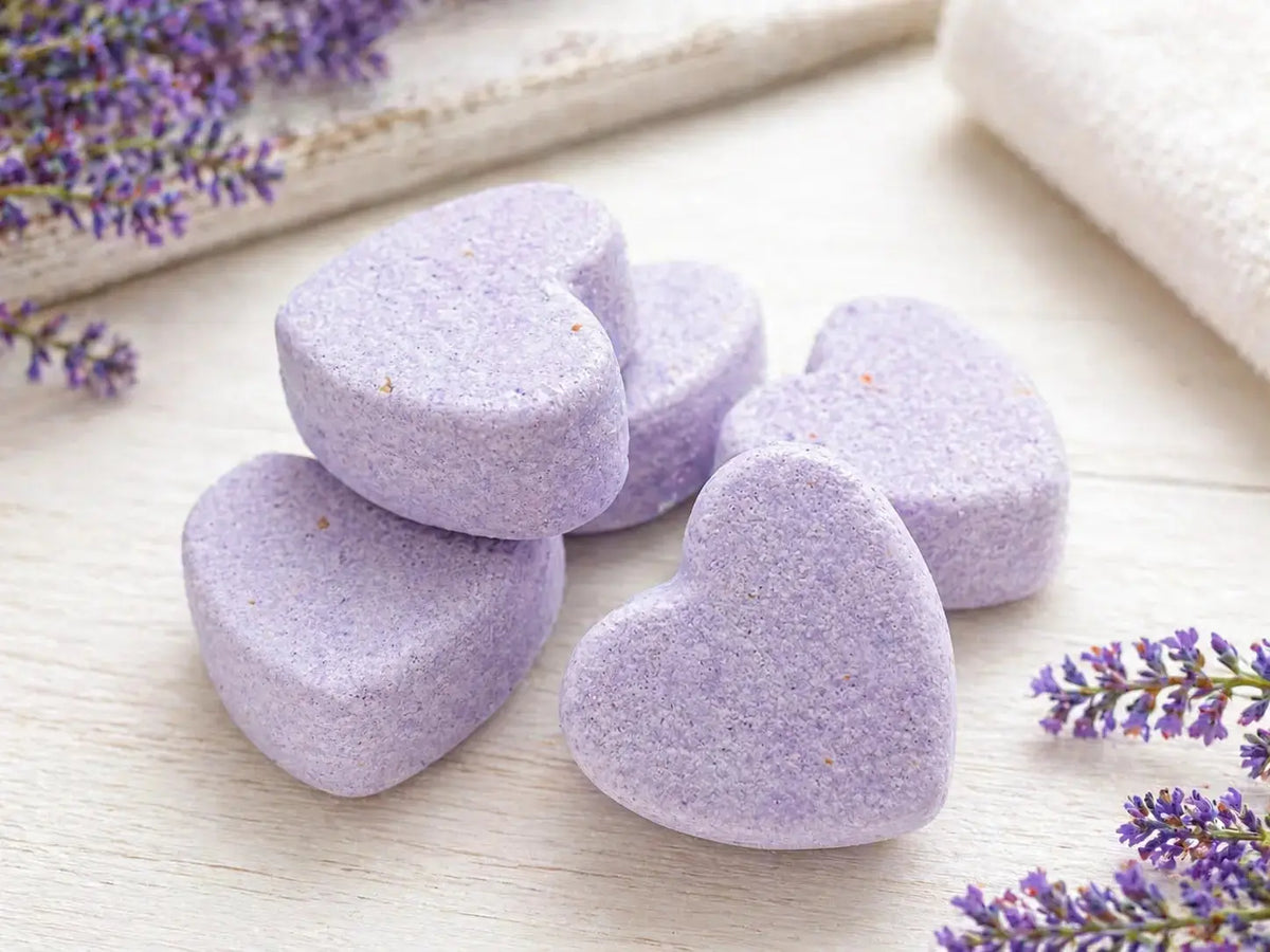 Four purple heart-shaped lilac scented bath bombs included in Annie Bear & Co spa gift box.