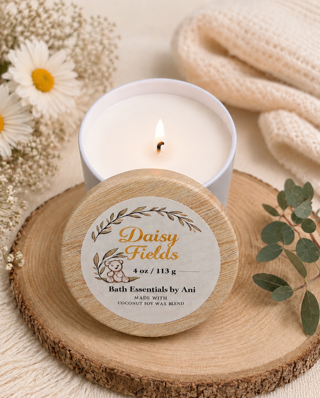 Daisy Fields scented candle in round tin with daisy label on wooden slice