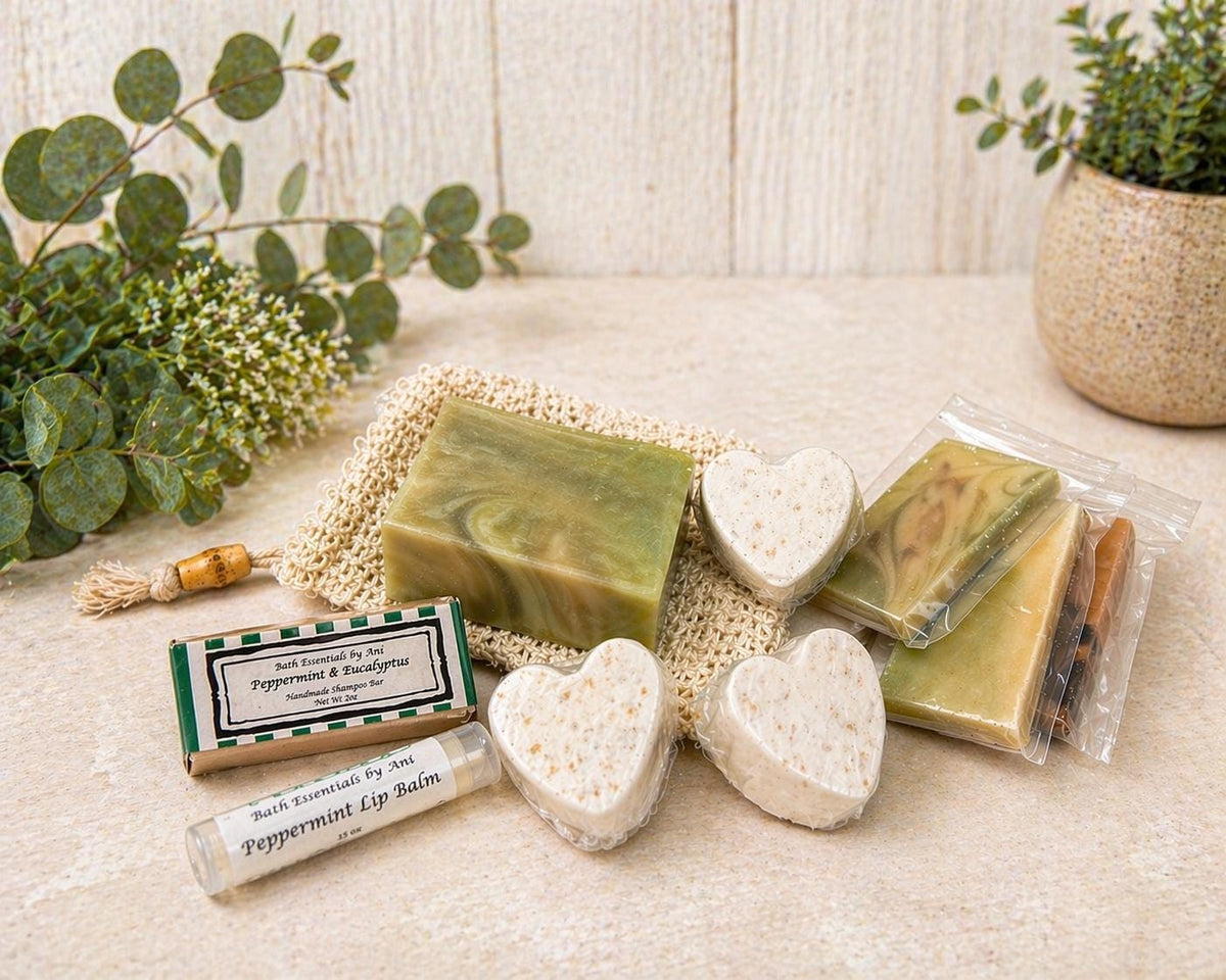 Bath set items on fabric: green soap bar, heart bath fizzies, and peppermint lip balm