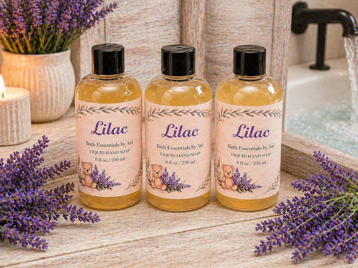 Three Lilac Liquid Soap bottles with purple accents and a shower spray in background