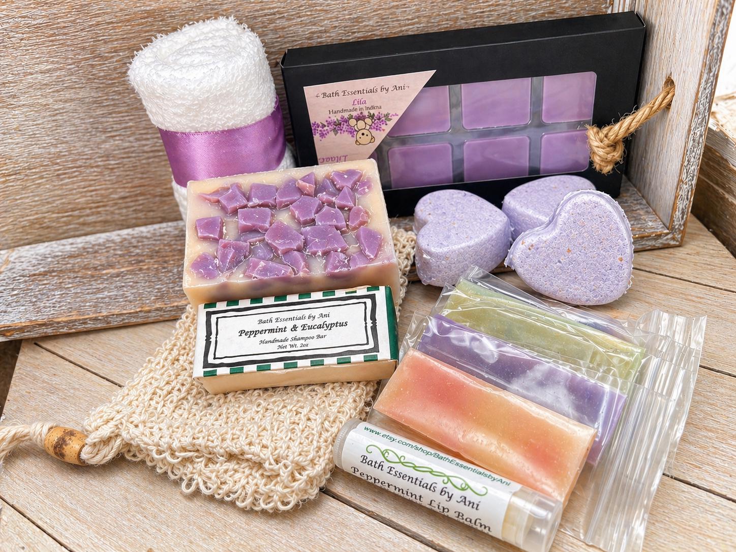Lilac spa gift set with lavender soap cubes, bath bombs, and packaged bars in box