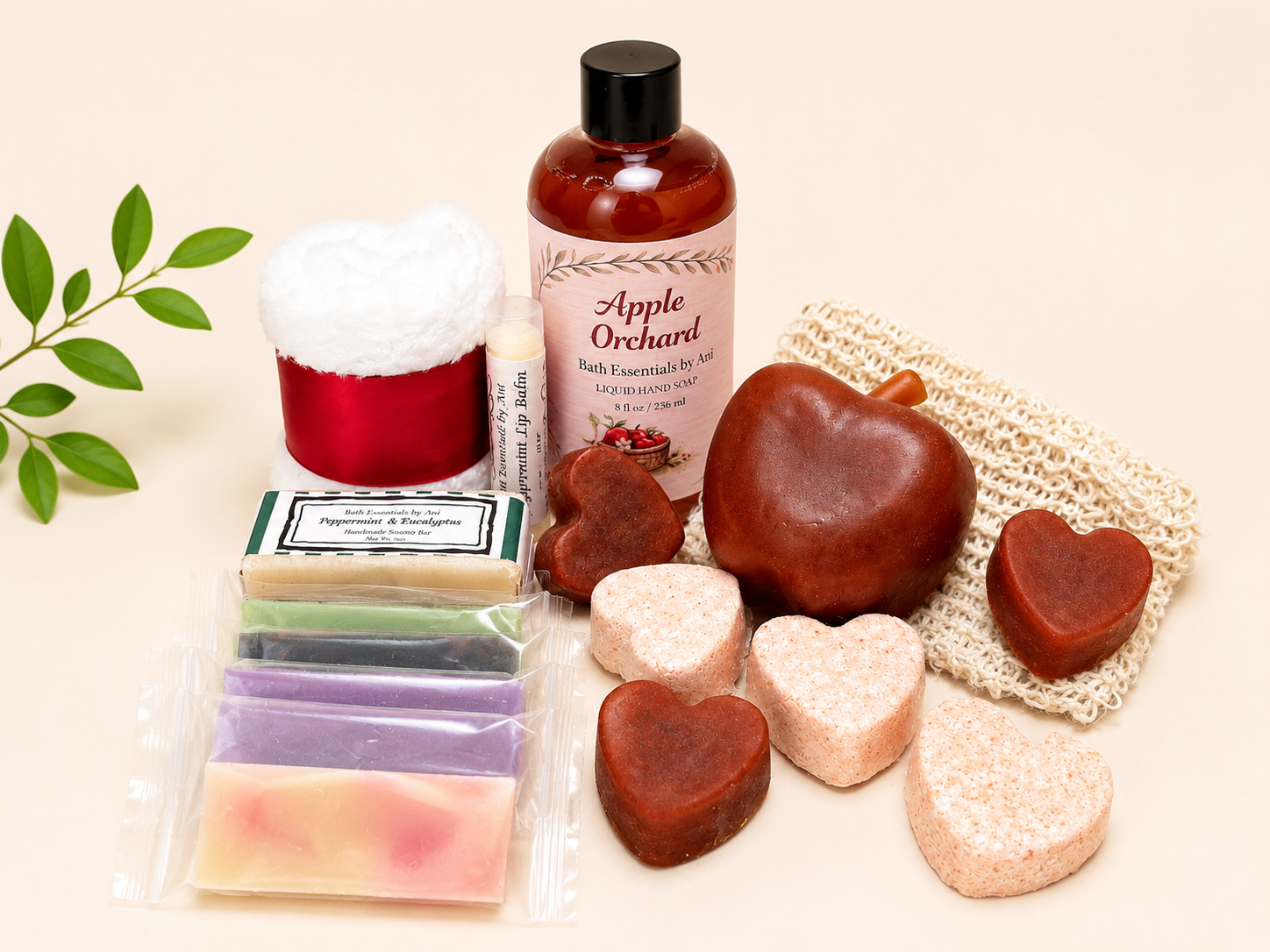 Apple Orchard bath gift set with amber bottle, scented candle tin, heart soaps, and mesh pouch