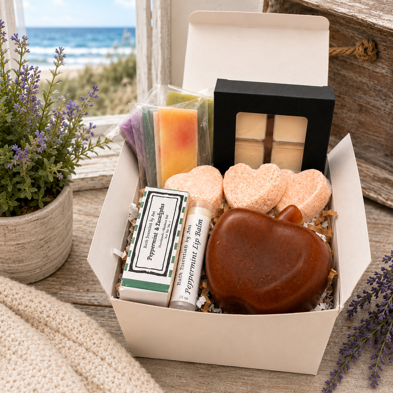 Spa gift box with orange soap heart, dark soap pieces, and pastel wax melt squares