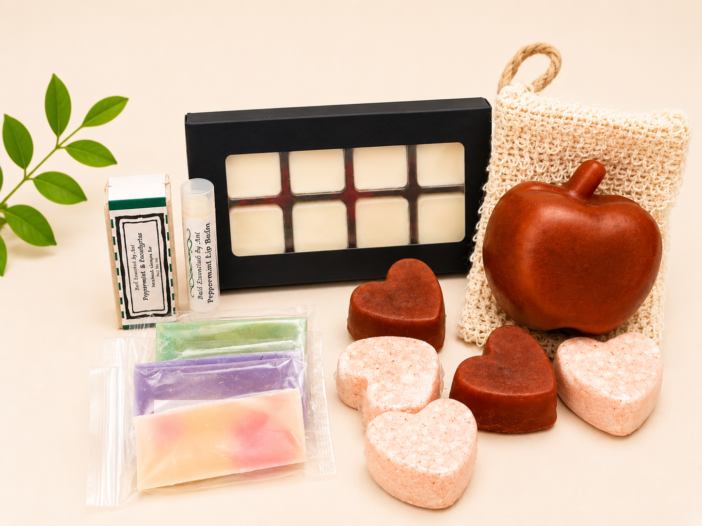 Bath gift set in box with apple-shaped soap, heart soaps, lip balm tubes and wax melts