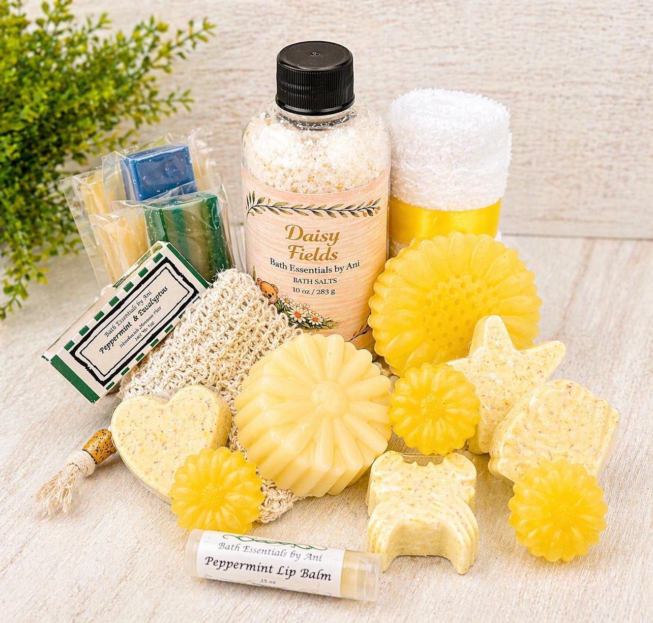 Bath gift basket with Daisy Fields bath essentials: yellow soaps, bath salt, and bottled essentials.