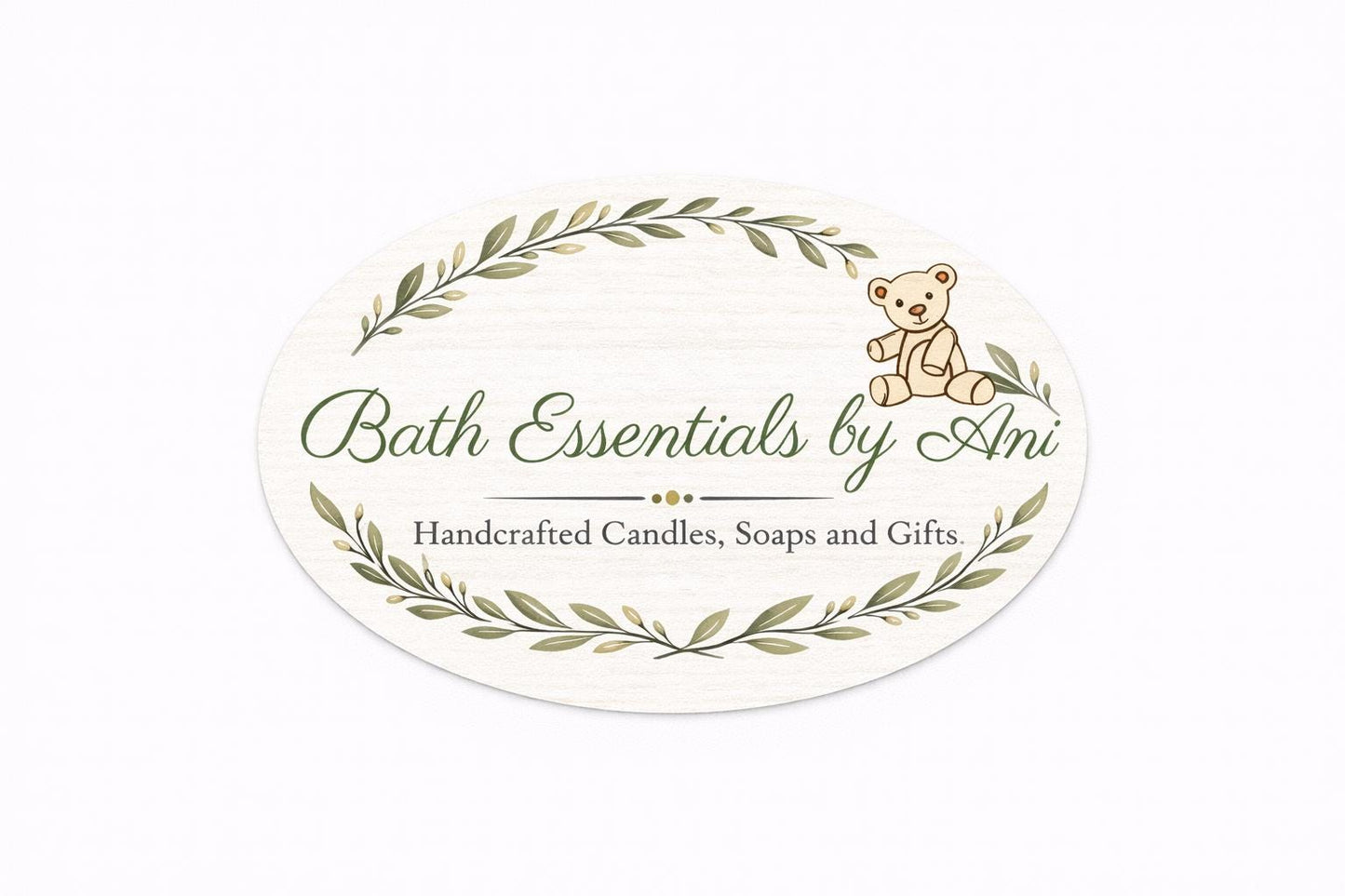 Round bath essentials label with laurel leaves and a bear icon, text centered on white
