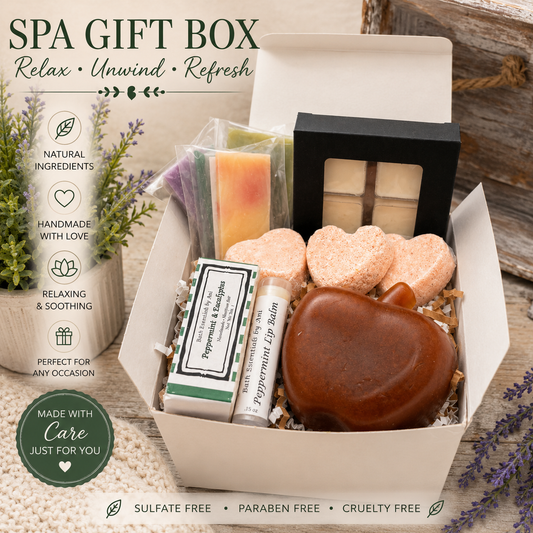Spa gift box with assorted bath soaps and bath bombs, including brown apple-shaped soap