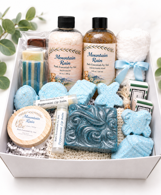 Blue bath and body gift set in a box with bath bombs, salts, soap, and lotion