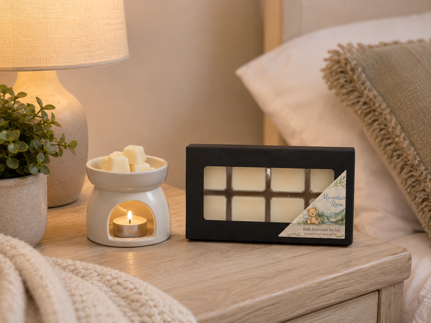 Spa gift set display with wax warmer candle, small soaps, and black melt box