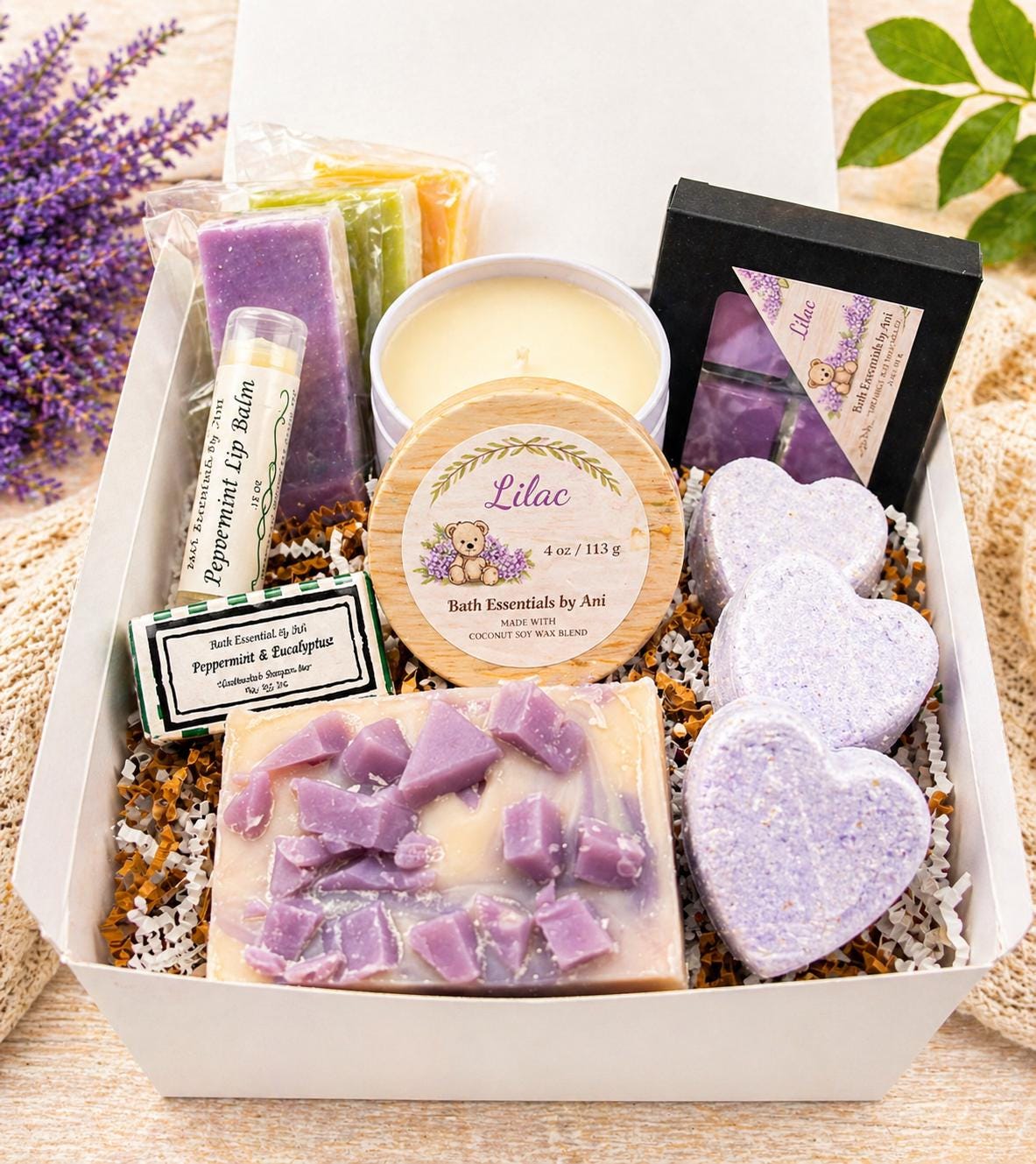 Lilac spa gift set with lavender candle, wax melts, bath bombs, and lip balm in box