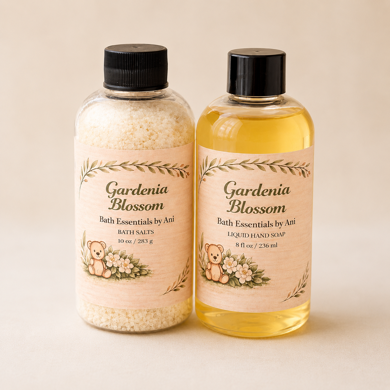 Gardenia bath essentials bottles with black caps, one yellow and one clear with salts