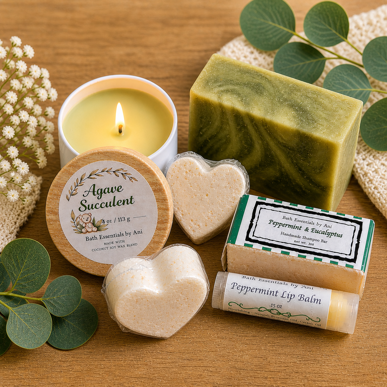 Candle, green soap bar, Agave Succulent tin, heart soaps, and lip balm on wood