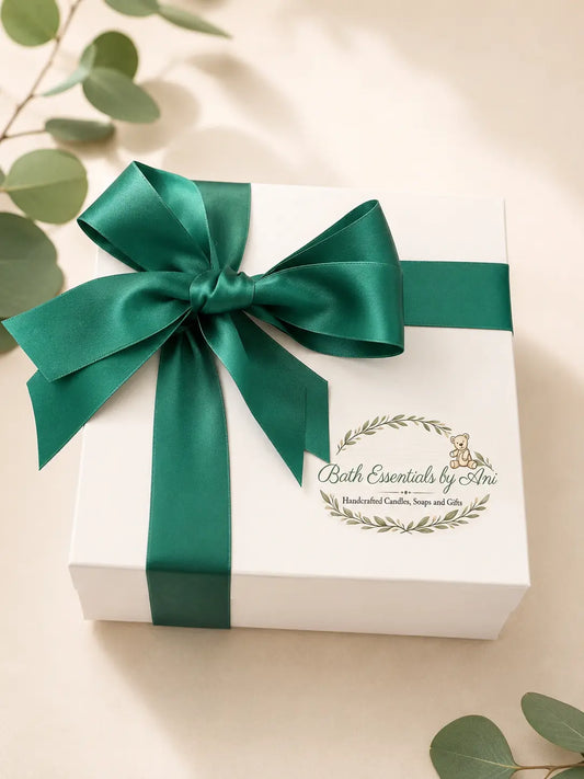 Spa gift box with green satin ribbon and Bath Essentials by Ani logo on the lid