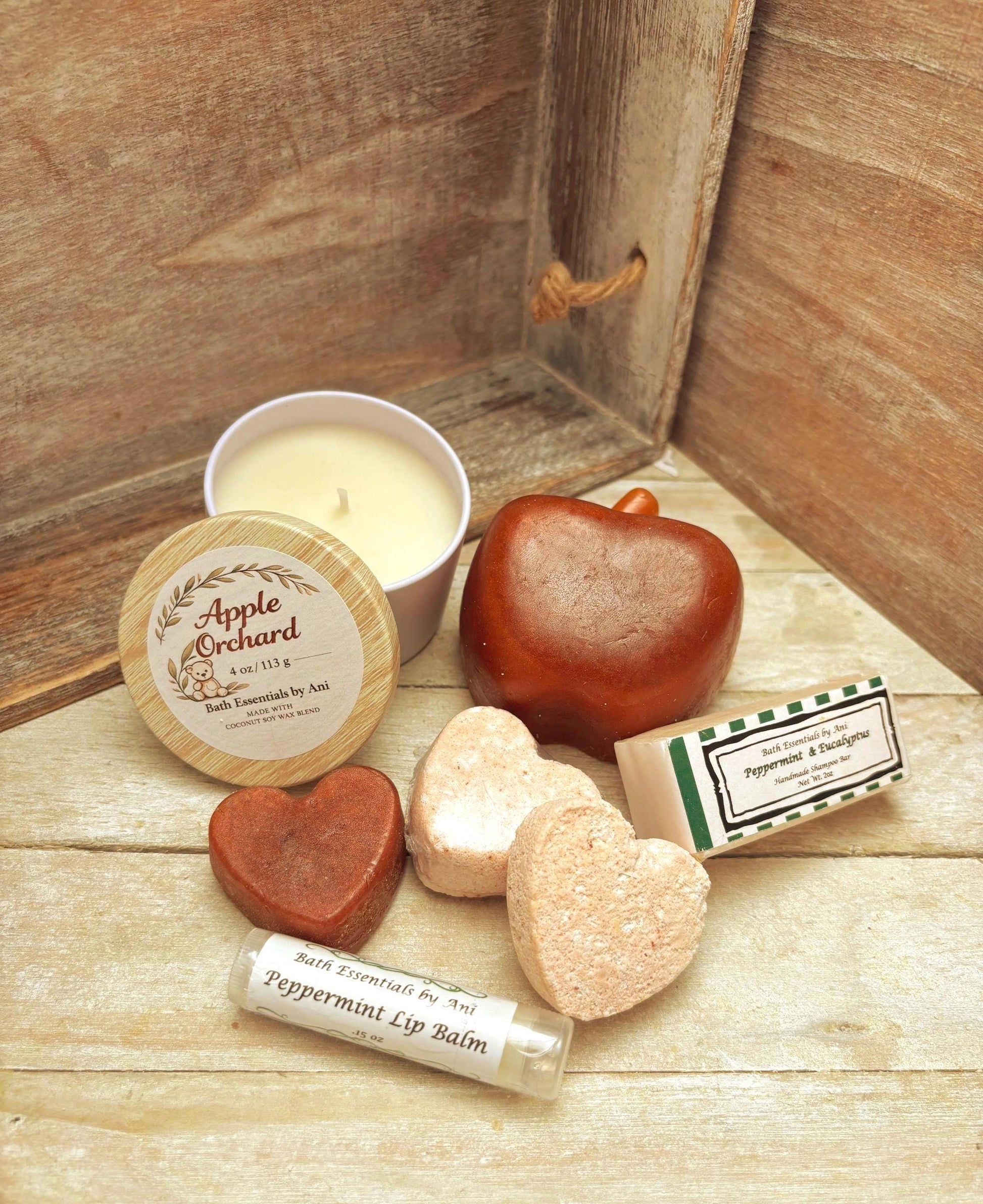 Spa bath essentials set with candle, apple soap, and peppermint lip balm tubes