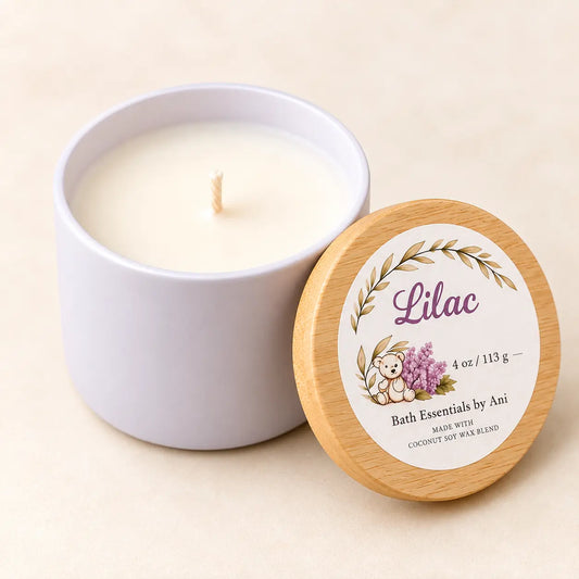 Lilac coconut soy candle jar with lit wick and wooden lid with Lilac label