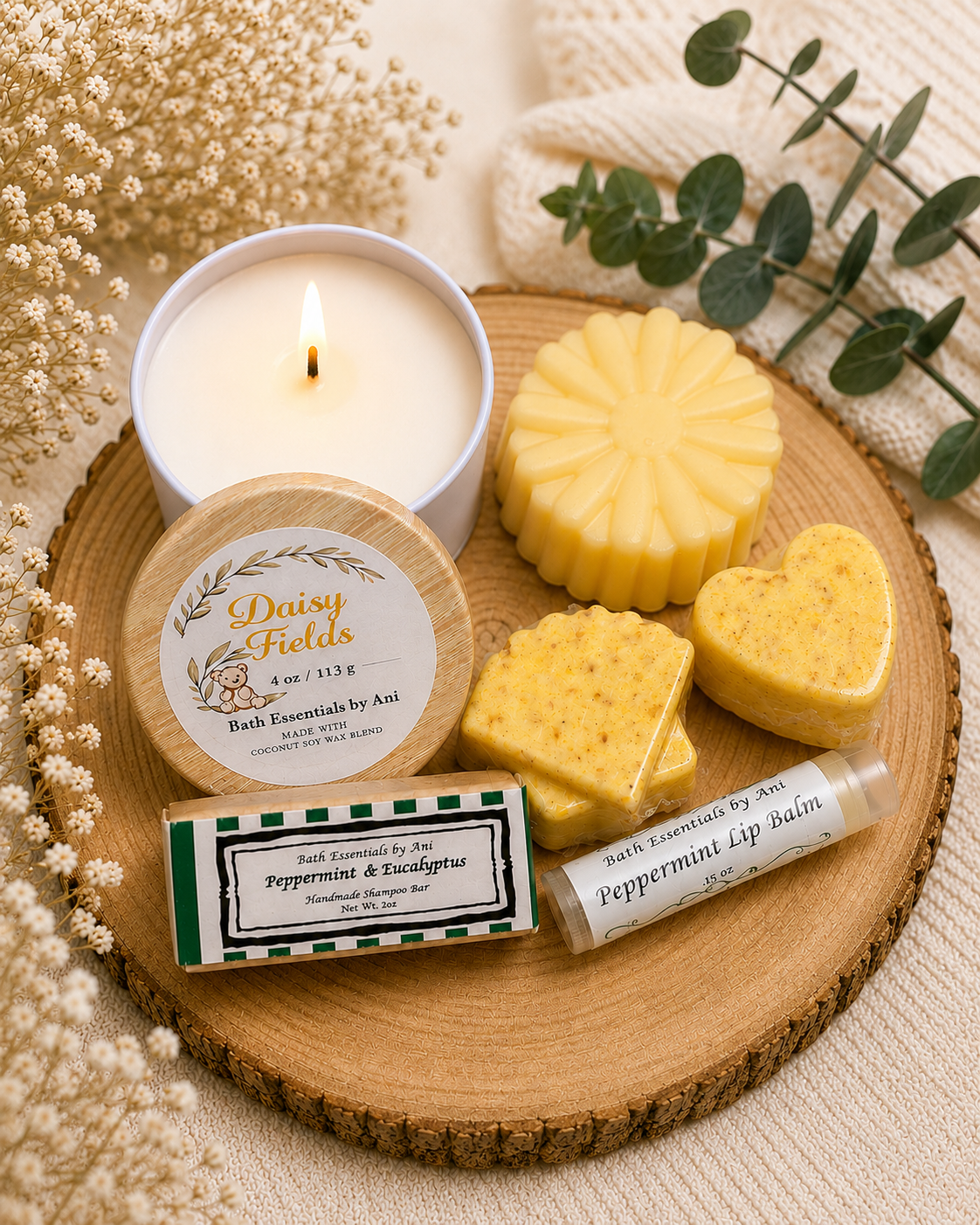 Daisy-scented bath set on wood tray with candle, yellow daisy soap, and balm bar