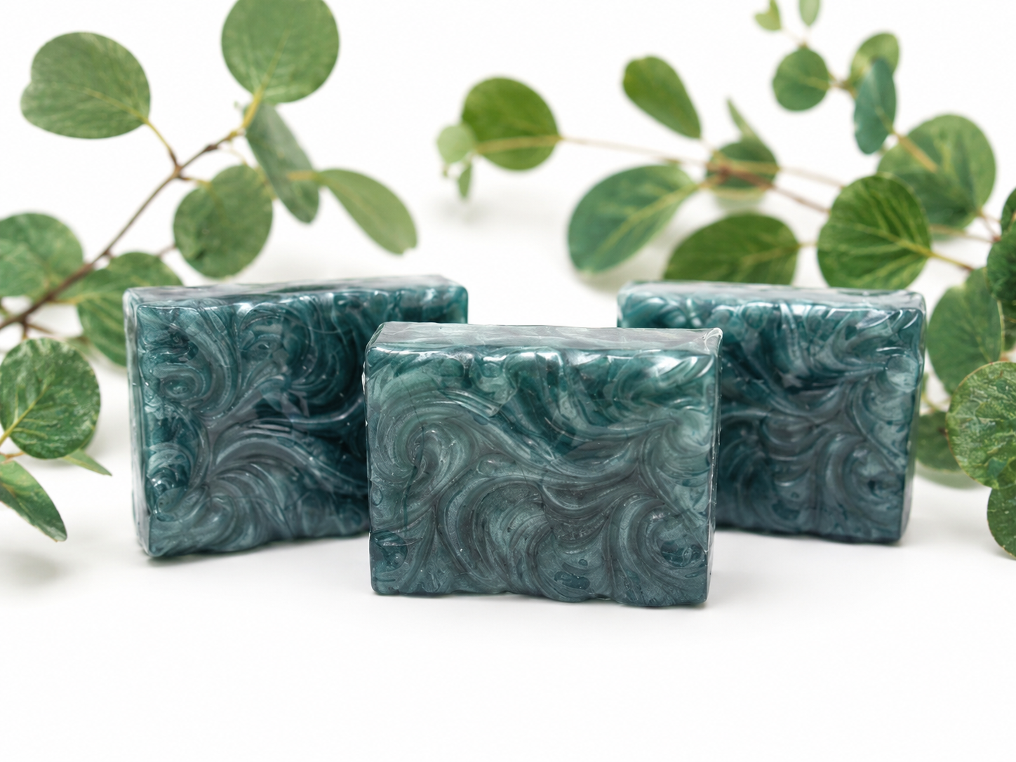 Blue handmade soap bars with marbled swirl pattern