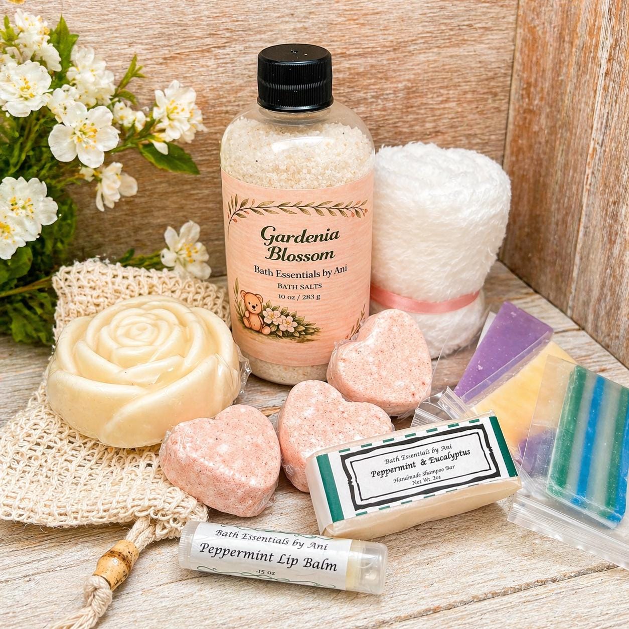 Bath gift basket with bottle bath salts, rose soap, heart bath bars, and lip balm
