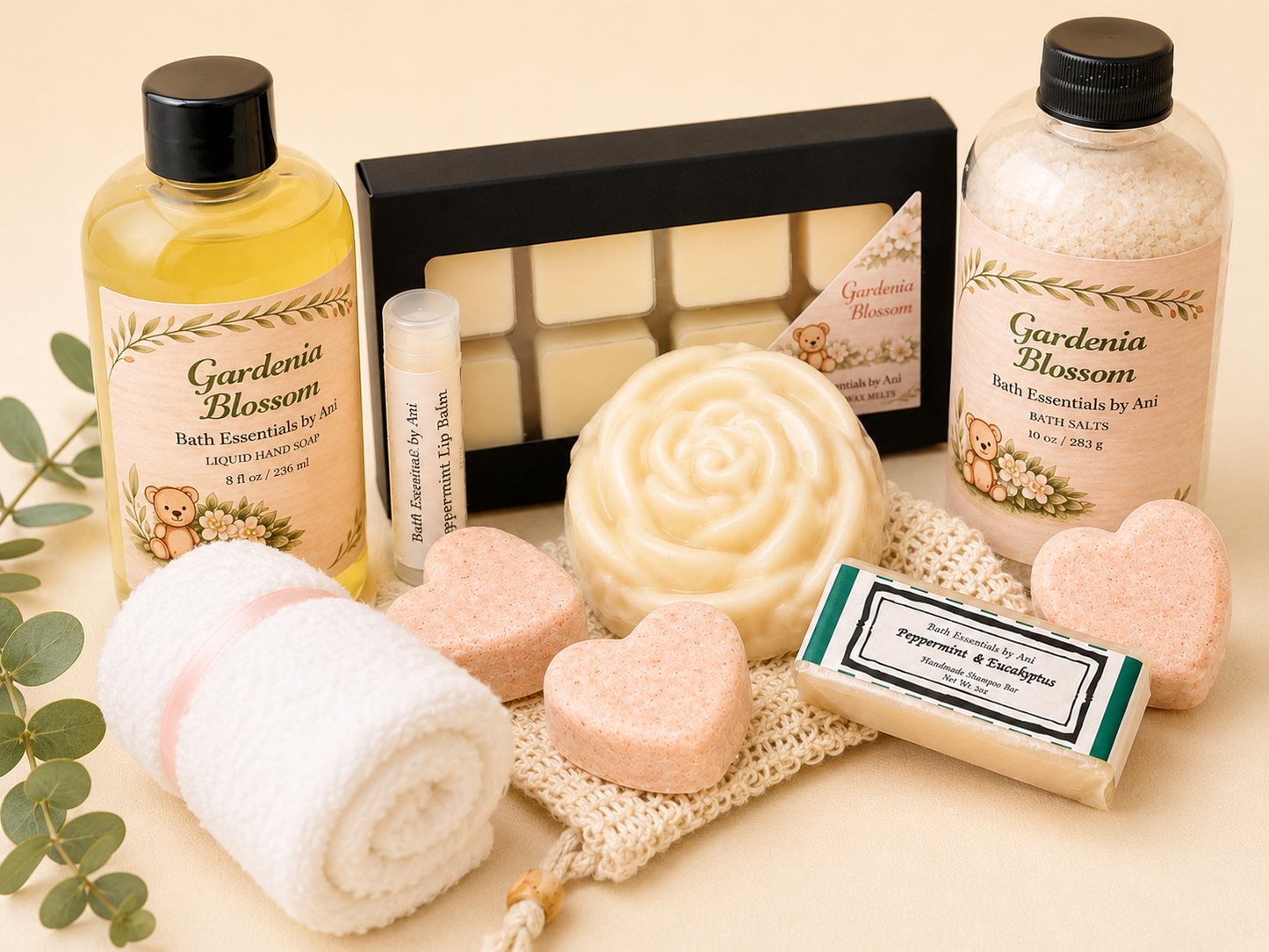 Bath gift set with gardenia bottles, white soap roll, pink heart bath bombs, and wax melt