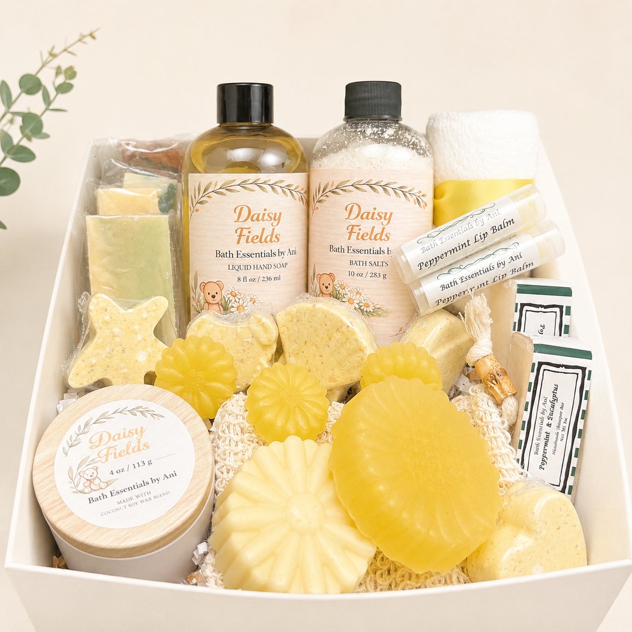 Spa gift basket with yellow daisy bath soaps, bath salts, hand soap, and candle