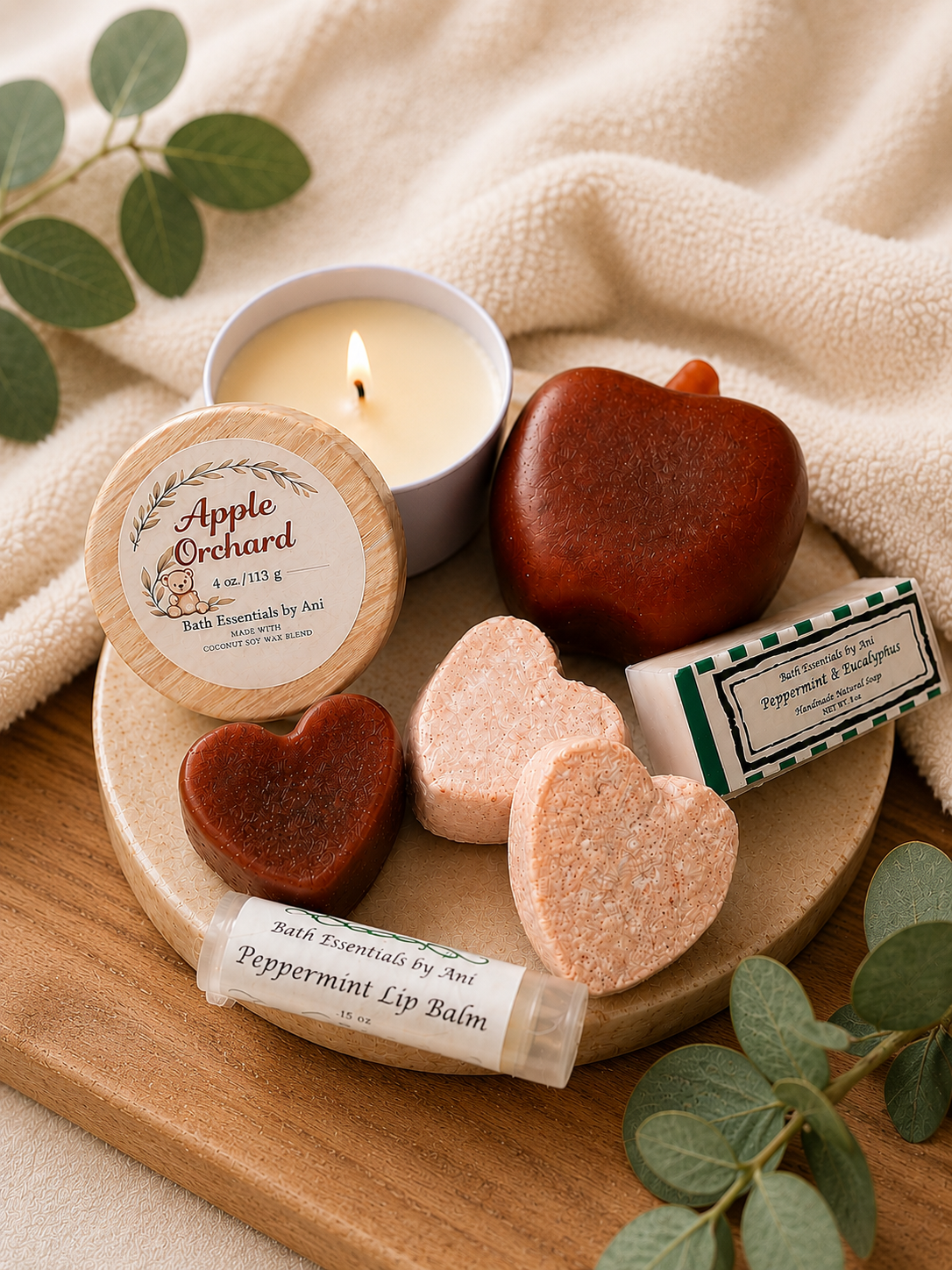 Apple spa gift set on wooden tray with candle tin, heart soaps, and lip balm