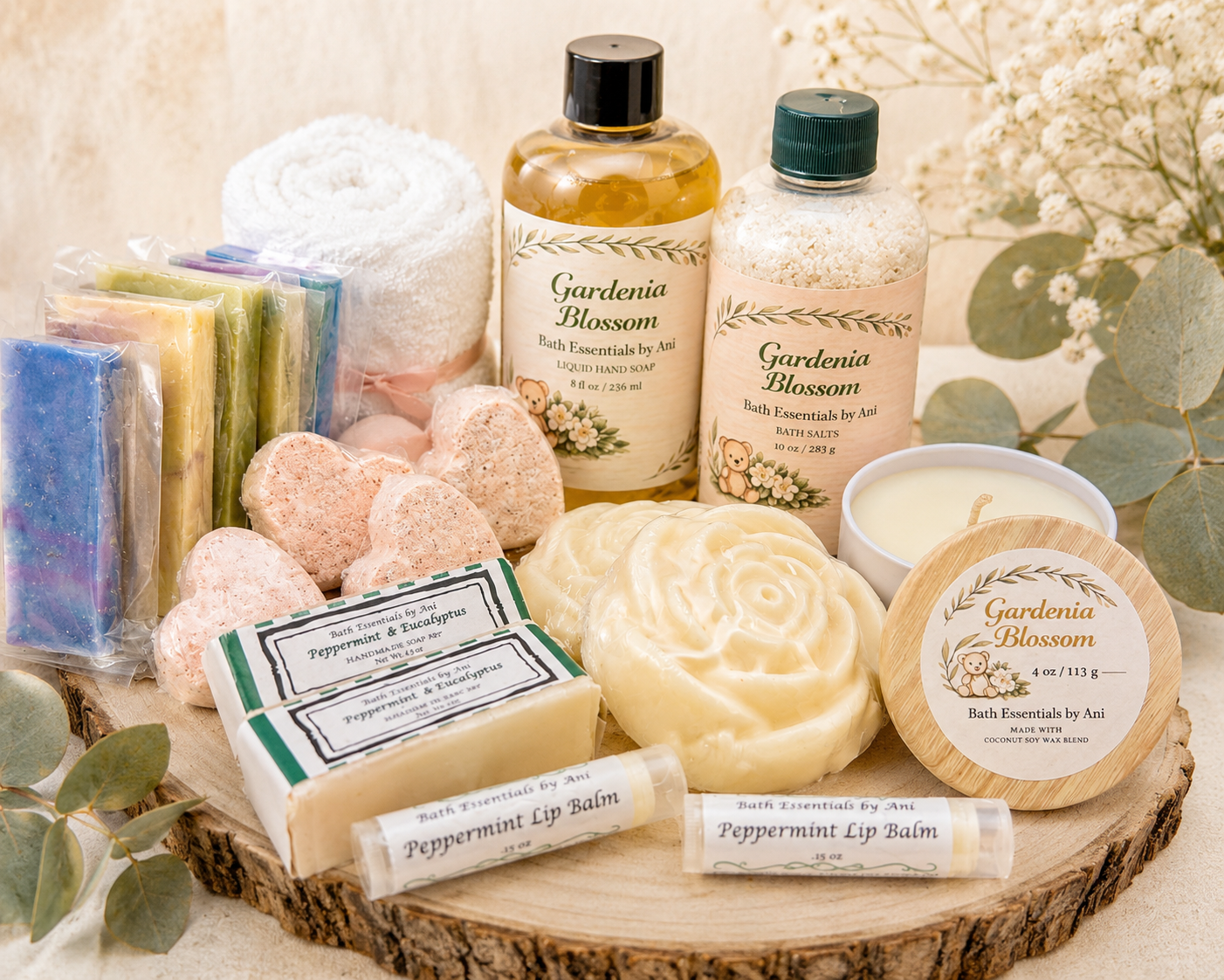 Spa gift tray with candle, swirl soap, heart soaps, balm tubes, and Gardenia bottles.
