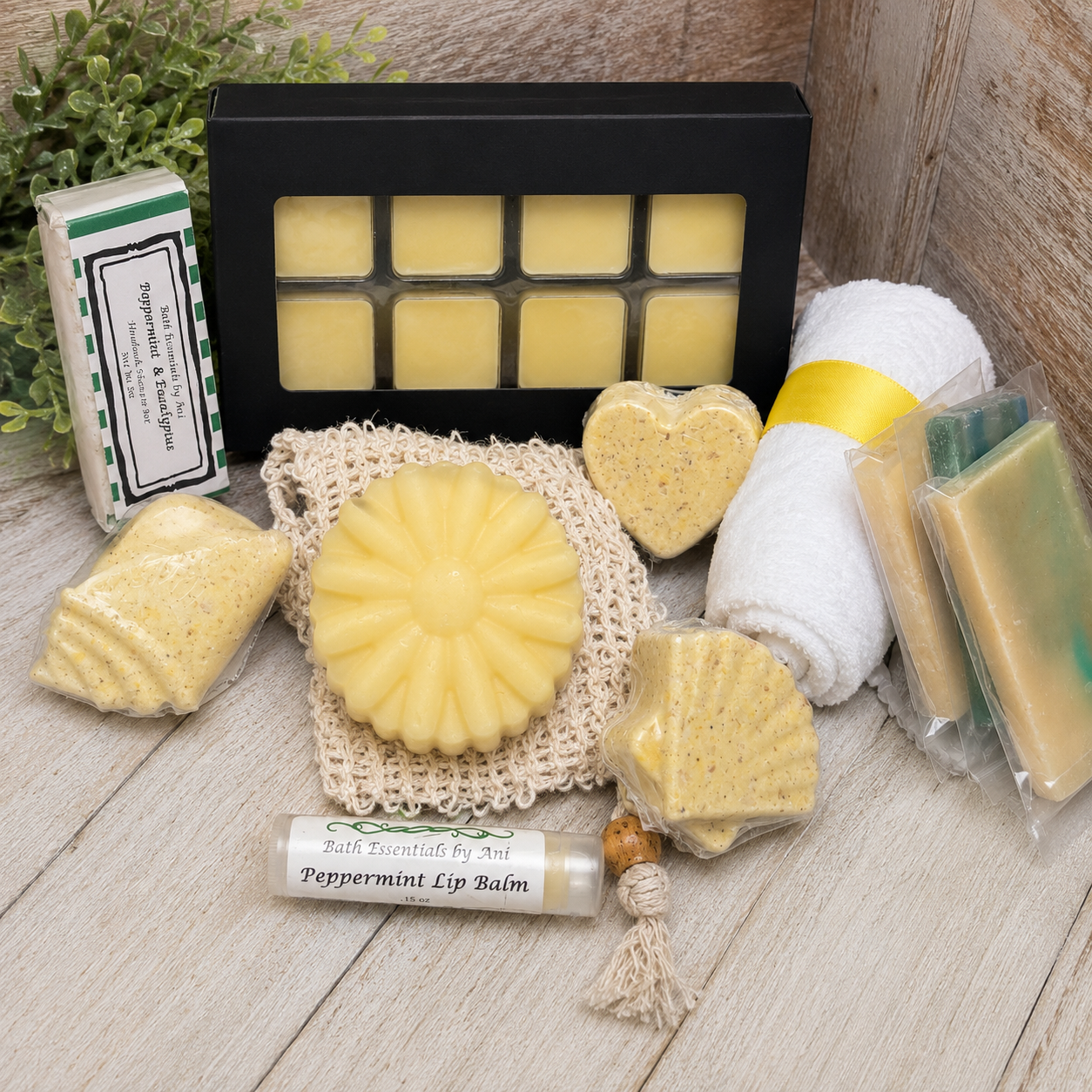 Yellow daisy bath gift set with yellow soaps, peppermint lip balm, and bath salt blocks