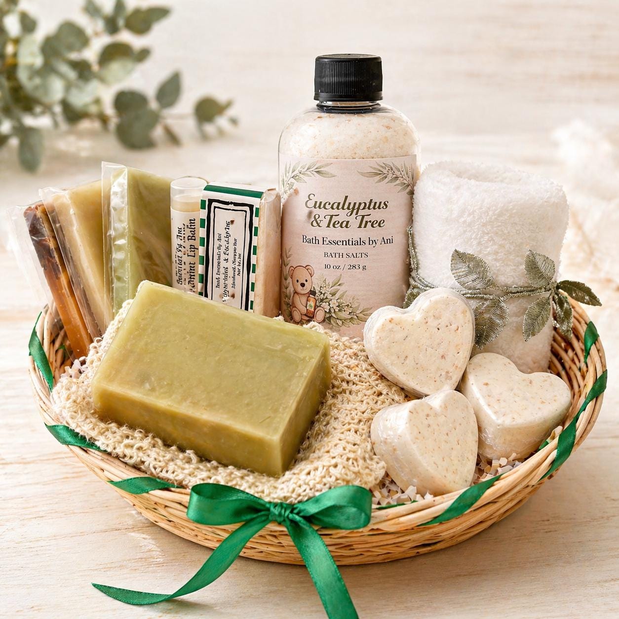 Basket of eucalyptus & tea tree bath essentials: bottle, soap bar, and bath salts in seas.
