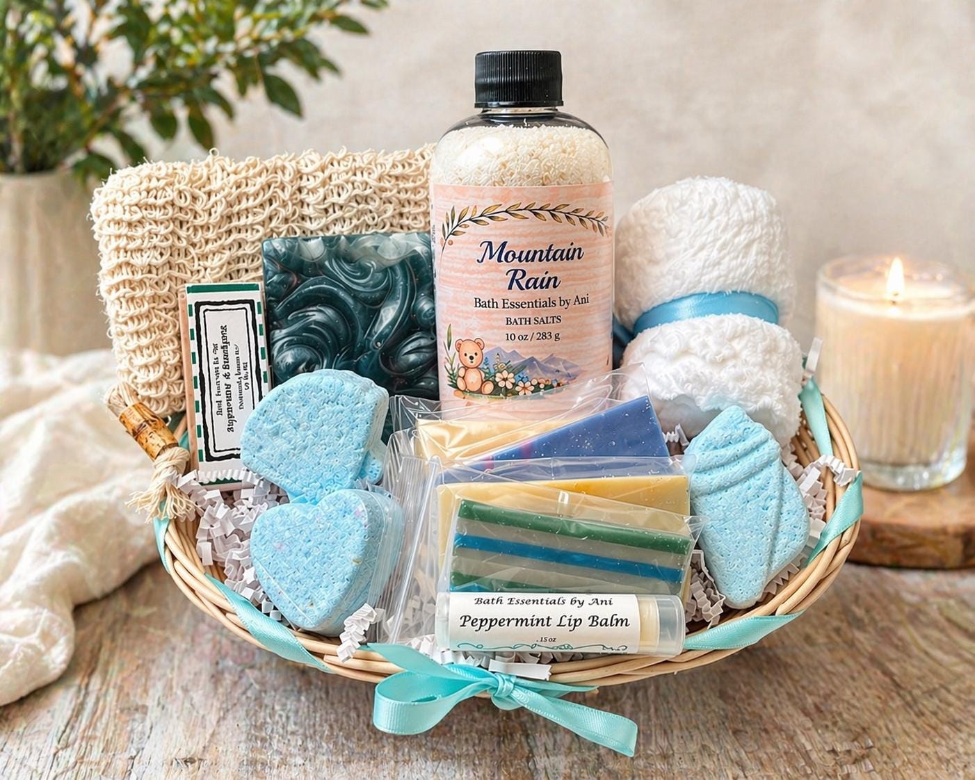 Mountain Rain spa basket with blue bath soaps, heart-shaped soaps, and a scented bottle.