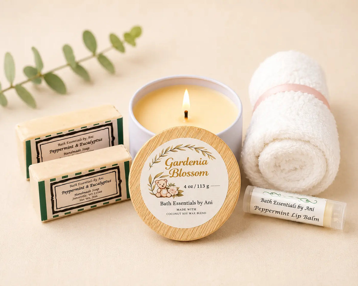 Spa gift set with lit candle, round bath essentials tin, soaps, and wrapped hand towel