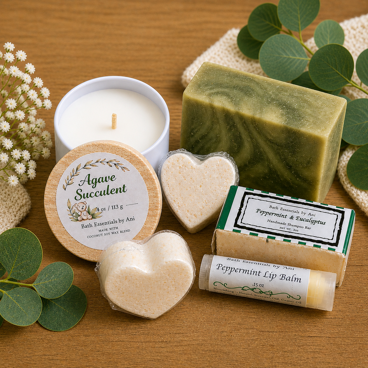 Bath gift set items: candle, heart soap, round agave tin, and green soap bar