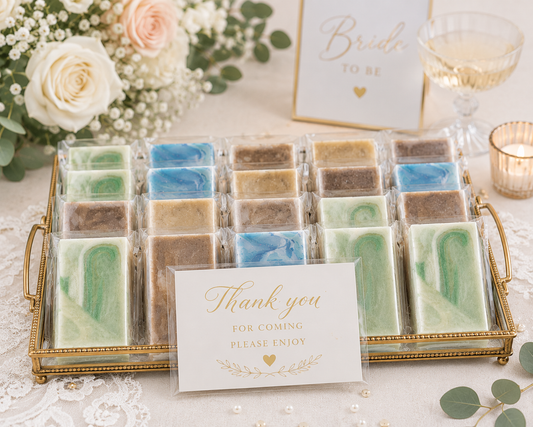 Soap variety pack with mixed green, blue, and brown bars in gold tray, with thank-you card