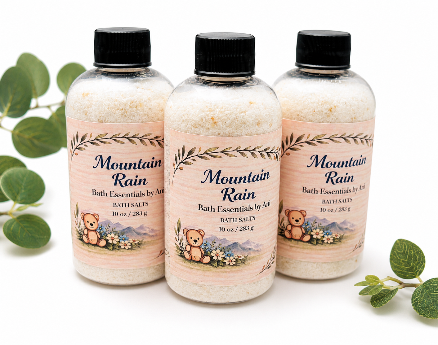 Three Mountain Rain bath salts bottles with illustrated labels on a clean white background