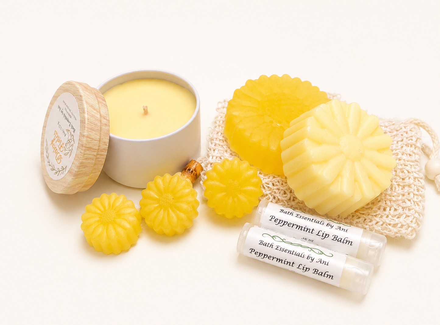 Peppermint lip balm and handmade soaps with one round candle in a bath set