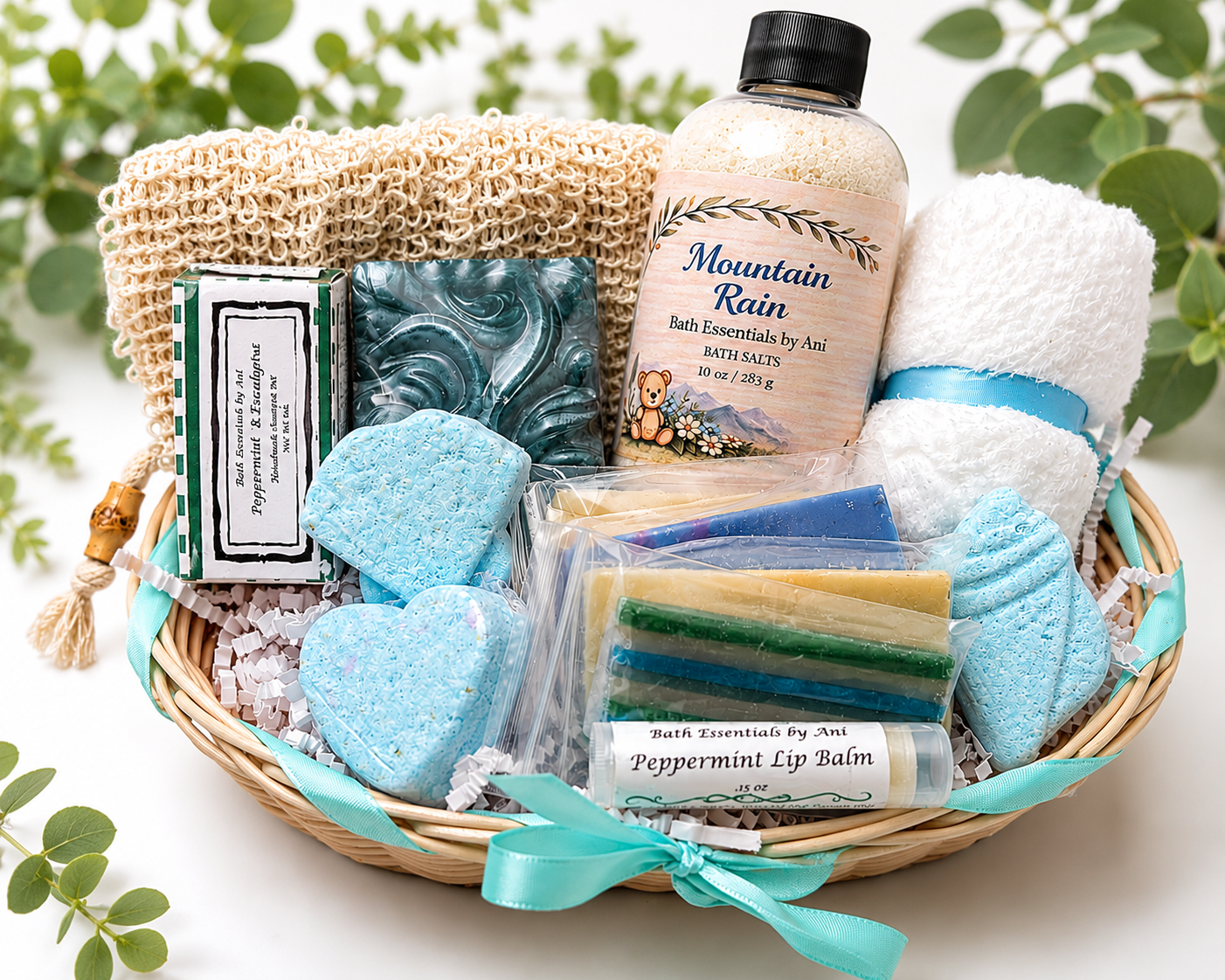 Spa gift basket with blue bath soaps, bath salts bottle, and wrapped soap bars