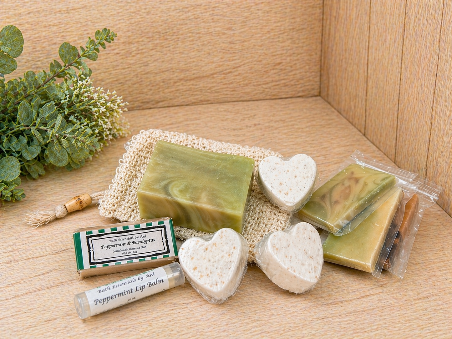 Packaged heart soaps with lip balm and green bar soap on display