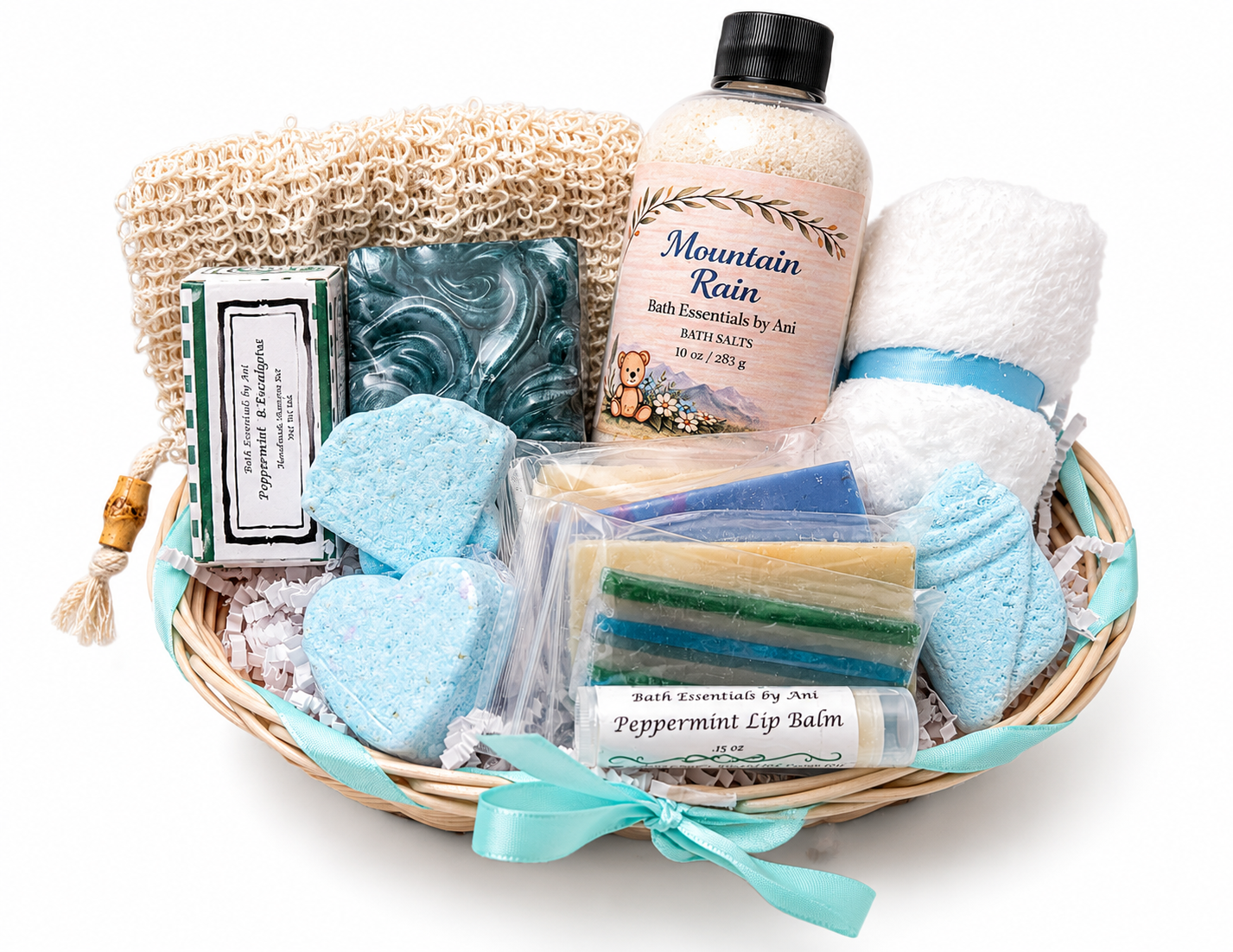 Spa gift basket with loofah sponge, blue soap, bath bomb pieces, bath salts bottle, lip balm bars