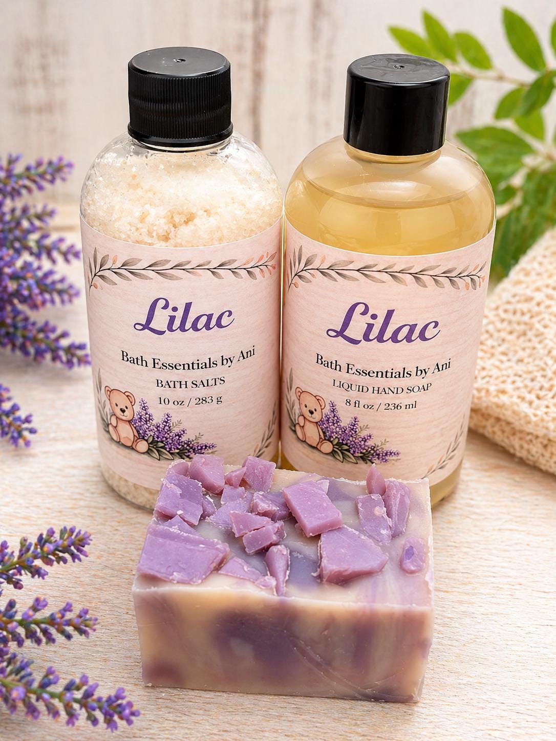 Lilac bath essentials set with two bottles and lavender-colored bath bar pieces