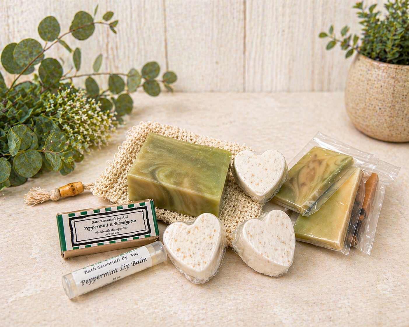 Soap bar, heart soaps, and wrapped bath items arranged on a neutral tabletop