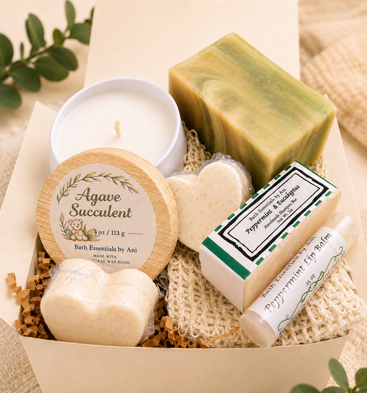 Self-care gift box with candle, soap bars, bath essentials tin, and lip balm tube