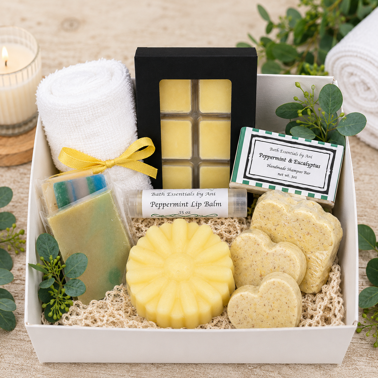Scented wax melt and soap gift set with yellow wax bar, soaps, and spa box