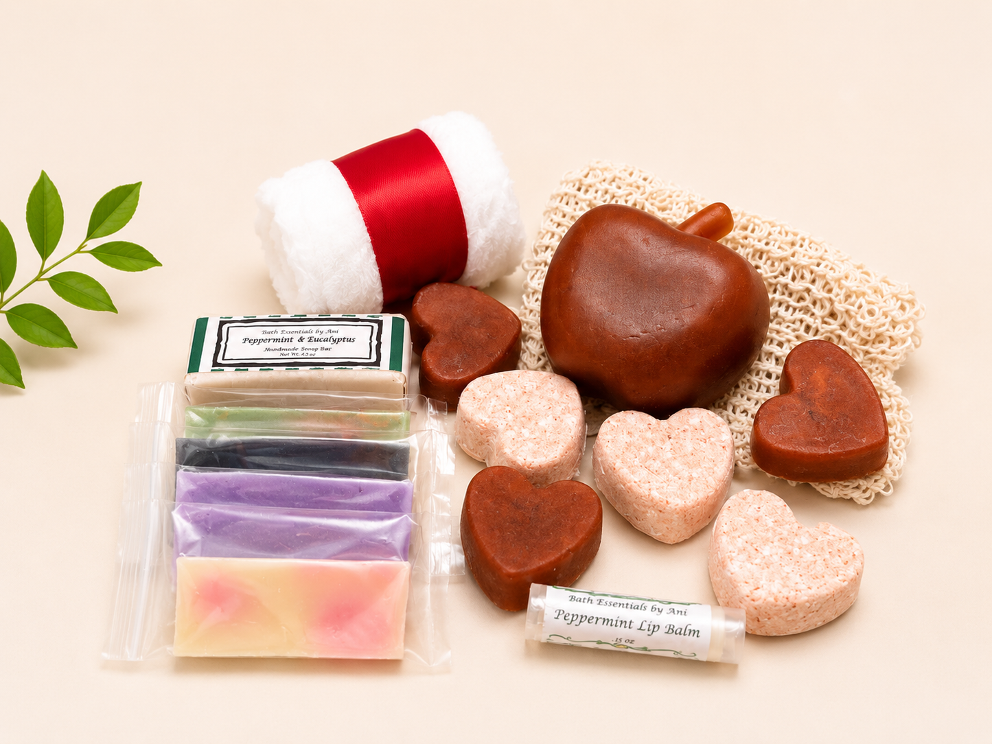 Self-care gift set with red-and-white towel, apple-shaped and heart soaps, lip balm