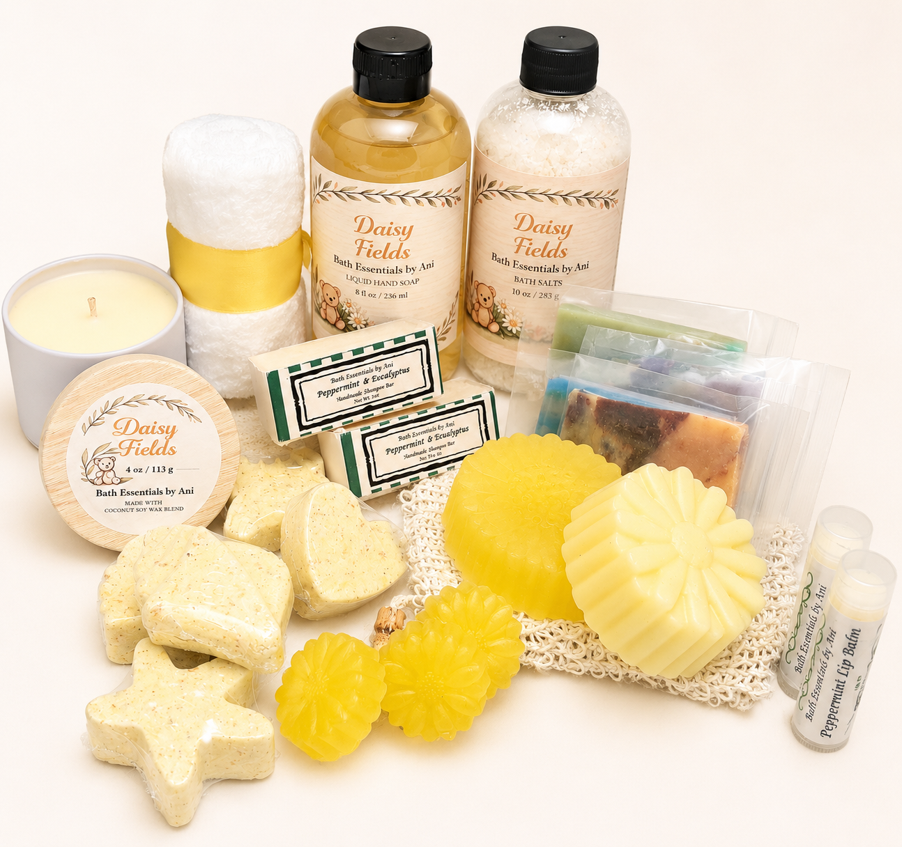 Handmade bath gift box set with yellow daisy soaps, bath bombs, candle, and lip balm