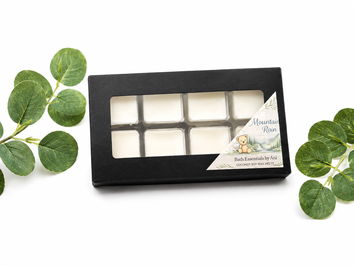 Black gift box with a window and Mountain Rain bath essentials by Ani card