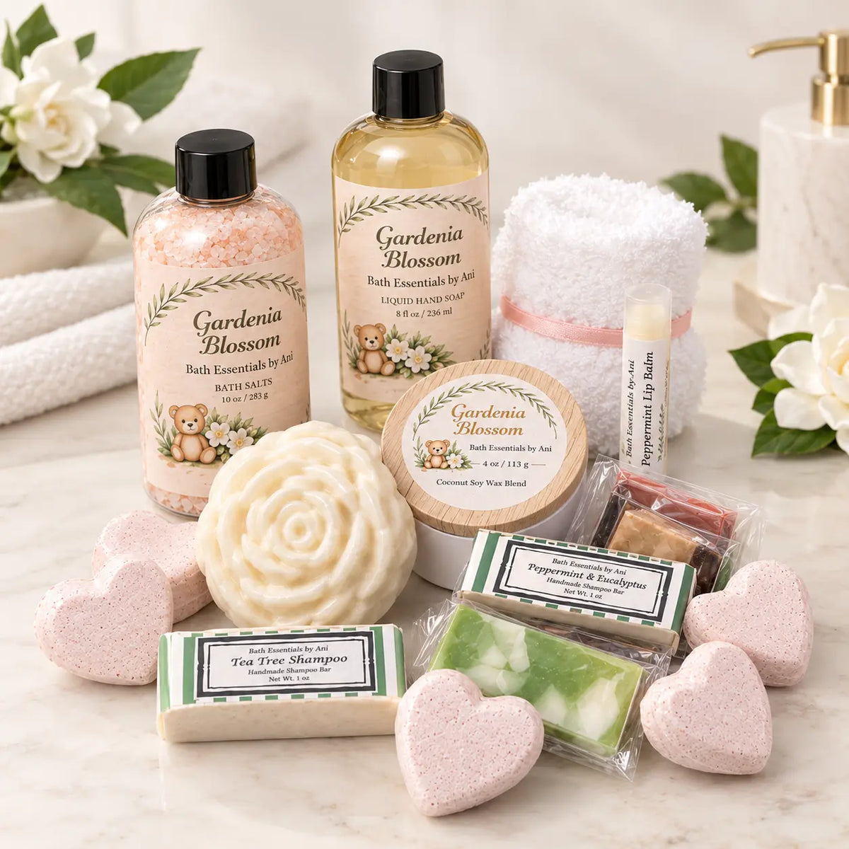 Gardenia blossom spa gift set with bath salts bottle, hand soap bottle, soaps, and shampoo bar