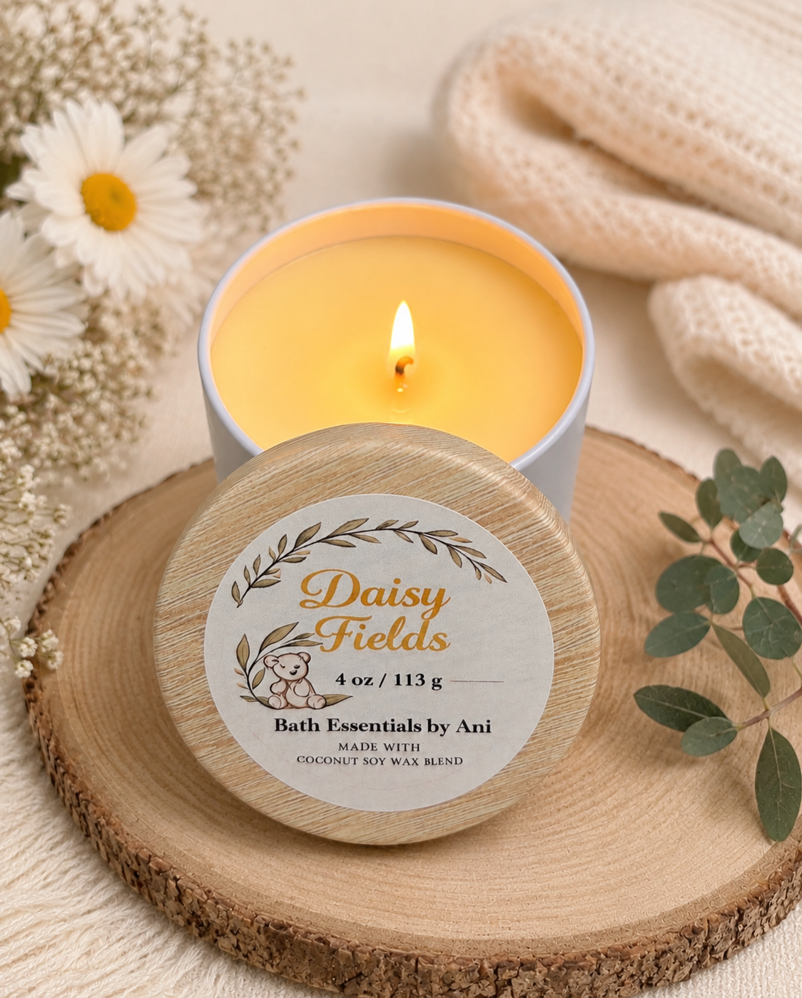Daisy Fields candle in round wooden dish with white floral accents